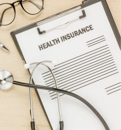 Health insurance form with stethoscope representing cashless hospitalisation and mediclaim support for oral cancer treatment at Heyansh oncology hospital in Ahmedabad.