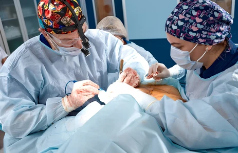 Surgical team operating on a recurrent oral cancer case, planning treatment around prior surgery, scar tissue, and disease spread at an oral cancer hospital in Ahmedabad.